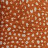 orange spotted velvet-chenille fabric from Utopia