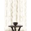 white contemporary cotton curtain from Colefax & Fowler and side table