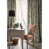 blue plain linen curtain from Colefax & Fowler and chair