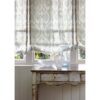 neutral plain linen curtain from Colefax & Fowler and table