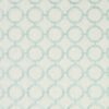 green geometric embroideried fabric from Clarke & Clarke