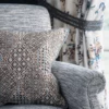 brown plain velvet-chenille cushion and a arm chair from Nina Campbell