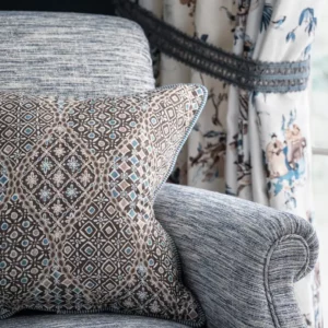 brown plain velvet-chenille cushion and a arm chair from Nina Campbell
