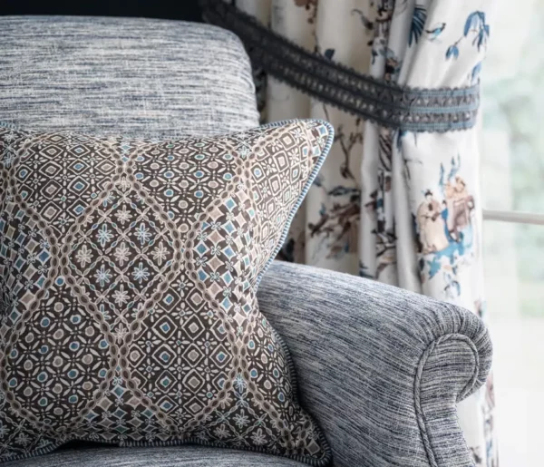 Merian Fabric - Aqua by brown plain velvet-chenille cushion and a arm chair from Nina Campbell