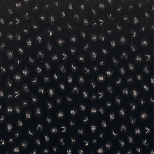 Daim Fabric - Noir by black-grey spotted embroideried fabric from Casamance