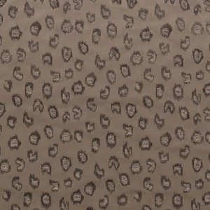 brown spotted embroideried fabric from Casamance