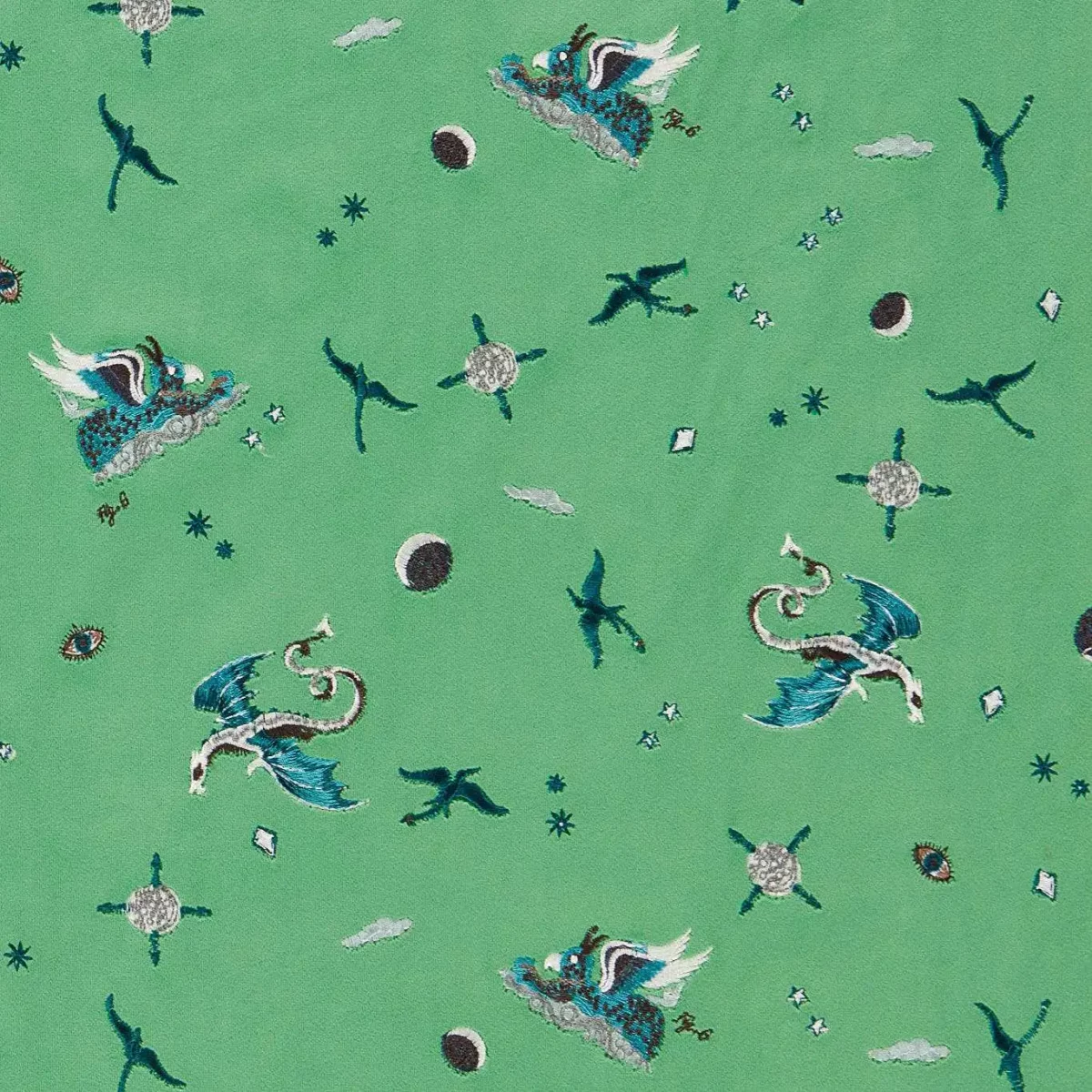 Draco Cosmos Embroidery Fabric - Green by green animal embroideried fabric from Emma Shipley
