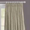 top half of curtain neutral cloth with green leaves and purple flowers on a white wooden pole