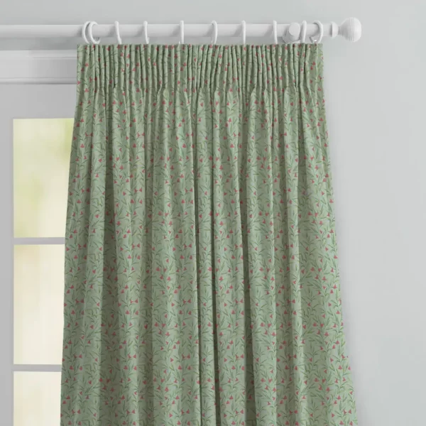 Bell Meadow Fabric - Oasis by top half of green floral curtains with pink flowers in pencil pleat heading on a white wooden pole