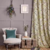 Cosy lounge with floral curtain fabric and rustic décor style