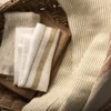 white textured fabric with basket
