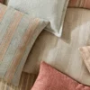 brown plain cushion with other cushions