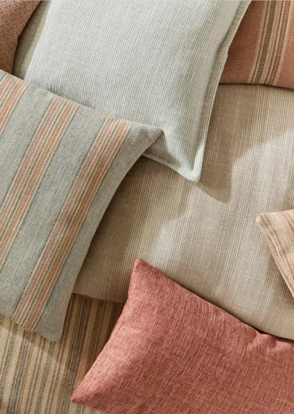 Danby Fabric - Almond by brown plain cushion with other cushions