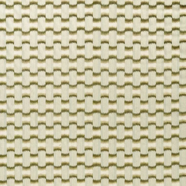 green geometric embroideried fabric from Harlequin