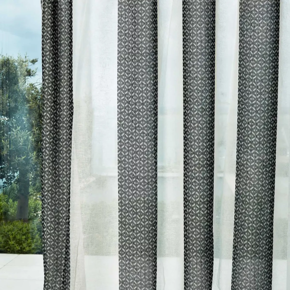 Ether Fabric - Chalk / Black Earth by black-grey striped voile-sheer fabric from Harlequin