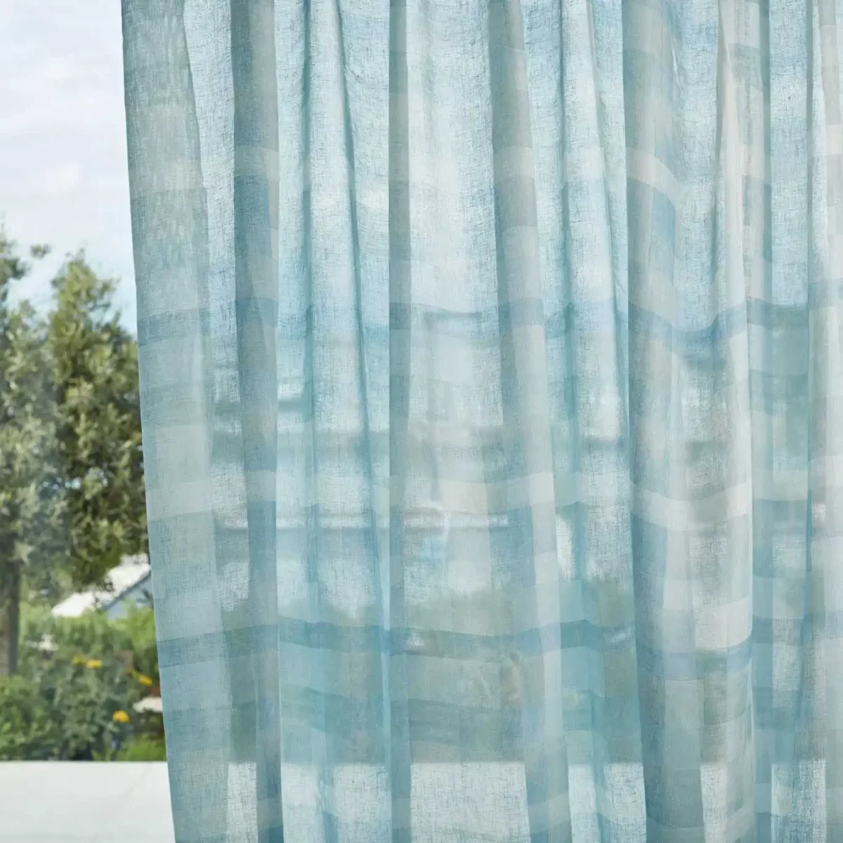 blue contemporary voile-sheer fabric from Harlequin