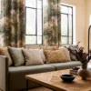 blue botanical cushion with sofa and curtain