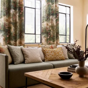 blue botanical cushion with sofa and curtain