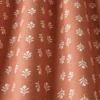 red botanical fabric with weave