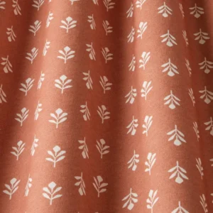red botanical fabric with weave