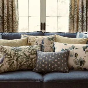 blue striped cushion with sofa and curtain