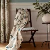green misc chair with curtain