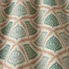 green checked cushion with sofa and rug