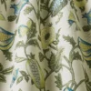 green botanical cushion with cushion and rug