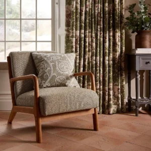 green botanical cushion with curtain and window