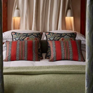 red striped cushion with bed and curtain