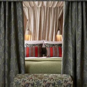 purple botanical curtain with bed and pouf