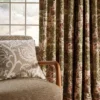 blue botanical curtain with armchair and cushion