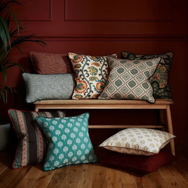 Segoa Fabric - Teal by yellow botanical cushion with cushion and wooden bench