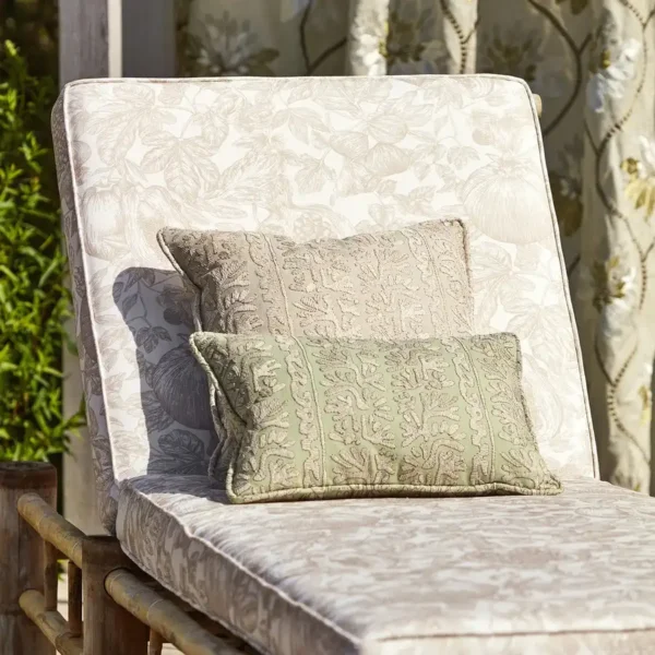 beige fabric sunlounger with cushions