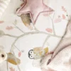 close up owl fabric in cot