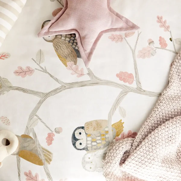 close up owl fabric in cot