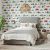 multi coloured trucks and vehicle wallpaper with bed