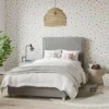 multi coloured dot wallpaper with bed