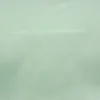 green plain cotton fabric from Designers Guild