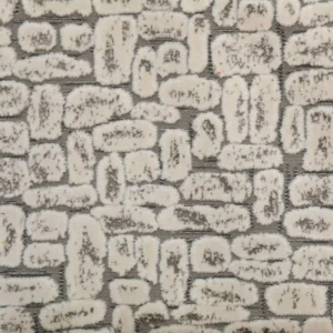 neutral spotted velvet-chenille fabric from Clarke & Clarke