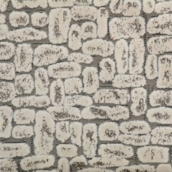 neutral spotted velvet-chenille fabric from Clarke & Clarke