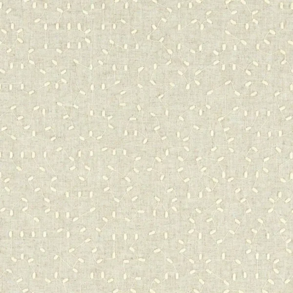 brown spotted embroideried fabric from Clarke & Clarke
