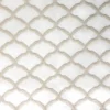 white geometric embroideried fabric from Clarke & Clarke