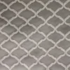 white geometric embroideried fabric from Clarke & Clarke