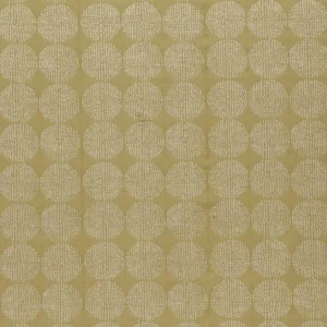 green geometric embroideried fabric from Clarke & Clarke