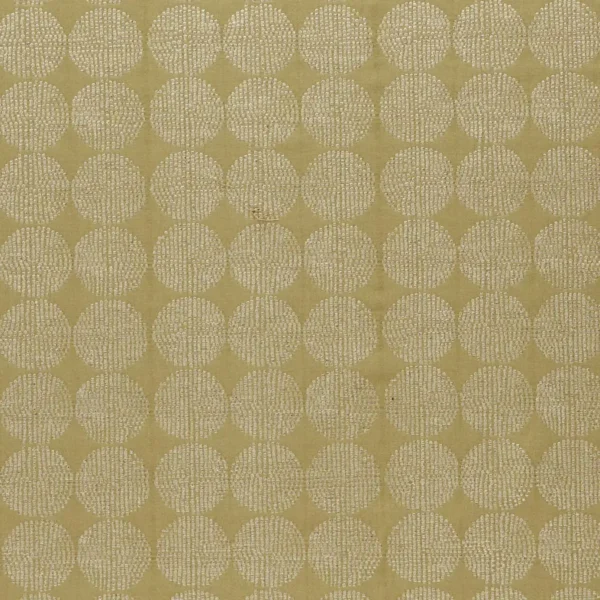 green geometric embroideried fabric from Clarke & Clarke