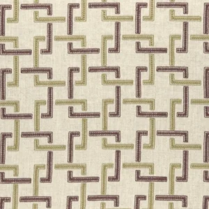 green geometric embroideried fabric from Clarke & Clarke