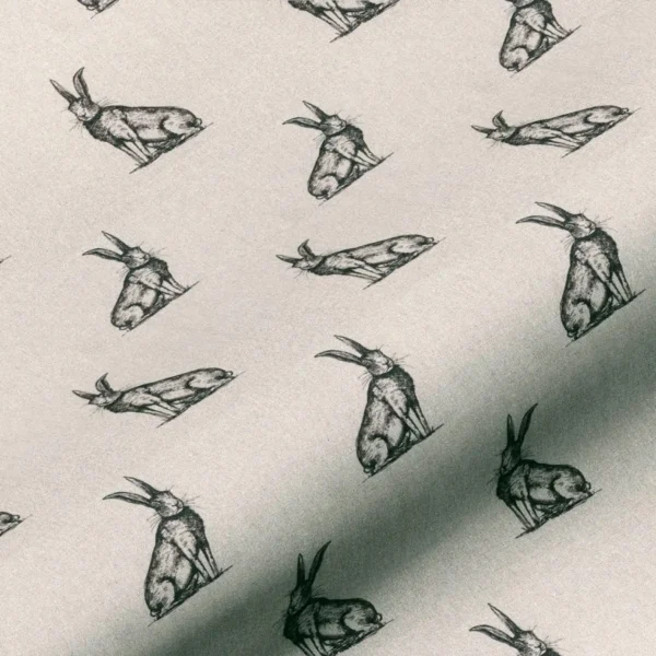 Horace Hare Fabric - Black / Linen by black-grey animal linen fabric from Art of the Loom
