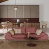 RED GEOMETRIC COUCH WITH STRIPE CUSHIONS AND KITCHEN IN BACKGROUND