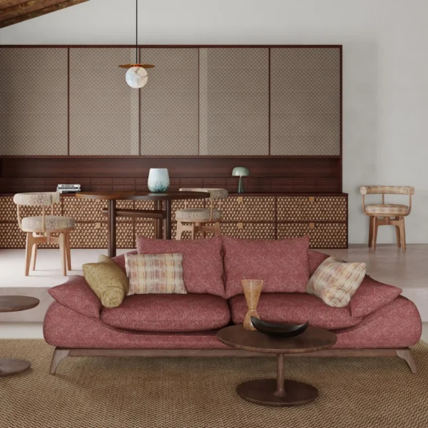 RED GEOMETRIC COUCH WITH STRIPE CUSHIONS AND KITCHEN IN BACKGROUND